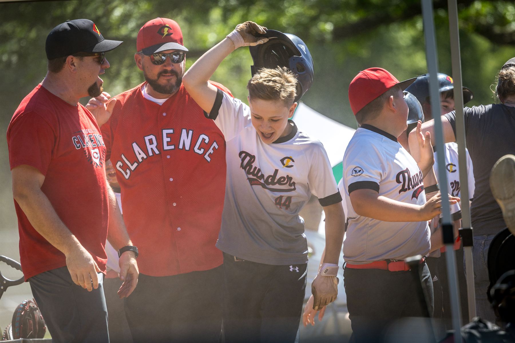 Clarence Thunder coaches watching from the dugout